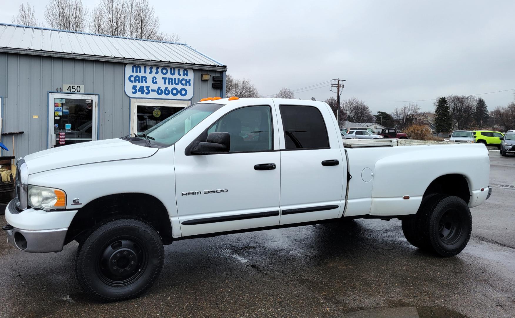 2005 White /Black Dodge Ram 3500 SLT (3D7LS38C85G) with an 5.9L I6 24V Cummins engine, 6 Speed Manual transmission, located at 450 N Russell, Missoula, MT, 59801, (406) 543-6600, 46.874496, -114.017433 - 4 Wheel Drive. One Ton Dually. Long Box. 6 Speed Manual Transmission. Has a lot of miles but runs amazingly. Air Cruise. Tilt. Power Windows and Locks. Power Drivers Seat. AM FM CD XM. 1 Owner. Clean Carfax. There is no financing options on this vehicle. - Photo#0